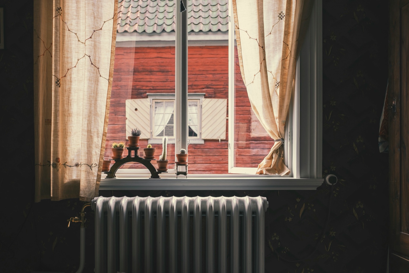 A mini-split and radiator in a remodeled older room